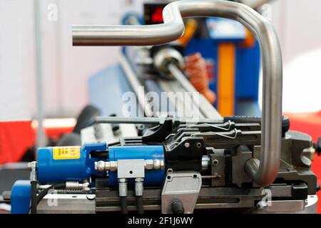 Industrial CNC pipe bending machine close up. Selective focus. Stock Photo
