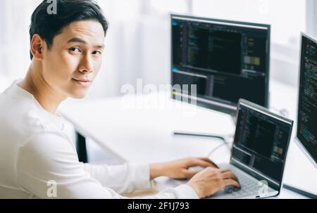 Asian male programmers are developing security software for computer systems Stock Photo