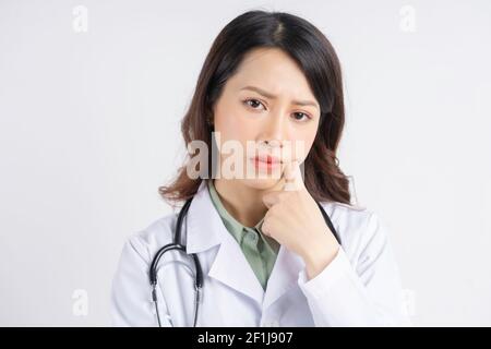 Portrait of Asian female doctor with a thoughtful expression Stock Photo
