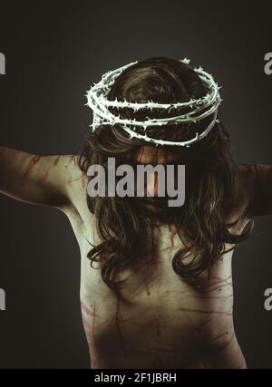 Jesus christ, representation of Calvary on the cross with crown of thorns and wounds, faith and religion Stock Photo