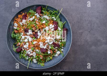 healthy home made couscous salad with sweet potato, beetroot and feta cheese