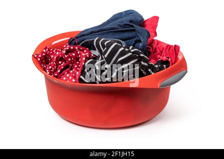 Red plastic wash bowl with clothing Stock Photo