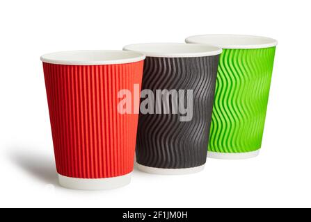 Three colorful disposable paper cups isolated on a white background with clipping path that doesn't include shadow Stock Photo