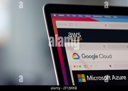 AWS, Google Cloud, and Microsoft Azure logos are seen respectively on the websites of the big three cloud providers on a laptop computer. Stock Photo