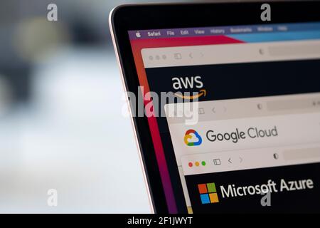 AWS, Google Cloud, and Microsoft Azure logos are seen respectively on the websites of the big three cloud providers on a laptop computer. Stock Photo