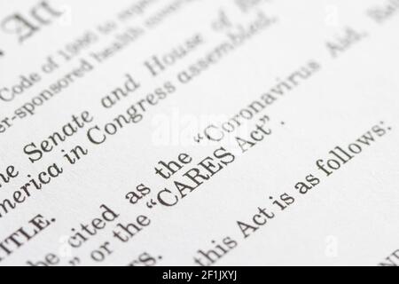 Closeup of the documents of the Coronavirus Aid, Relief, and Economic Security Act. The CARES Act is meant to address the economic fallout of COVID-19... Stock Photo