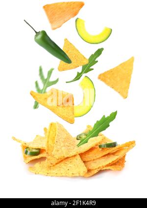 Flying nachos with ingredients on white background Stock Photo