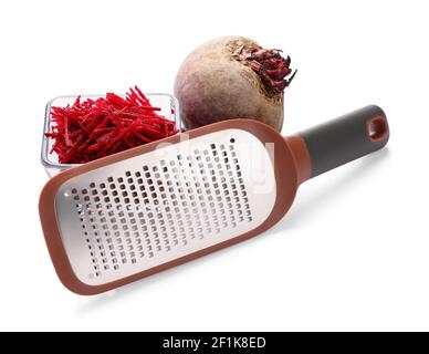 Metal grater and fresh beetroot on white background Stock Photo