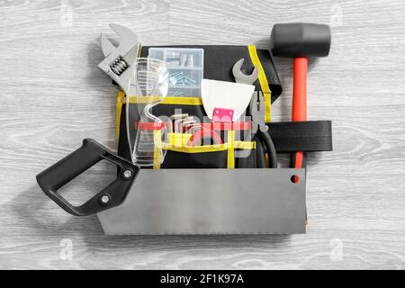 Set of construction tools on grey wooden background Stock Photo