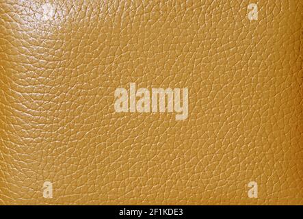 Texture of mustard colored cow leather for abstract background Stock Photo