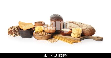 Composition with different cereals, raw pasta and bread on white background Stock Photo