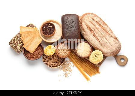 Composition with different cereals, raw pasta and bread on white background Stock Photo