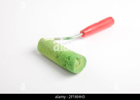 Paint roller in front of a white background Stock Photo