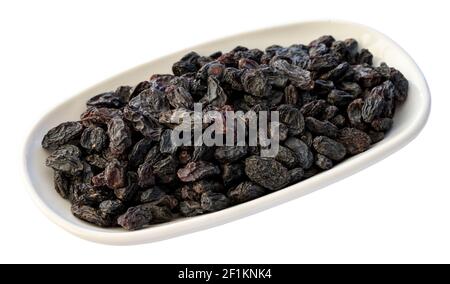 black raisins isolated on white background Stock Photo