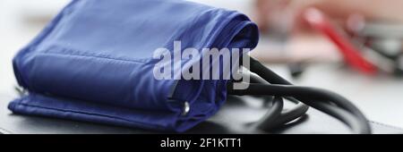 Blood pressure monitor lying on doctors table closeup Stock Photo