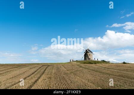 Tourists visit the famous and historic Moidrey Windmill near Le Mont Saint-Michel in France Stock Photo