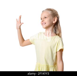 Cute little girl waving hand on white background Stock Photo