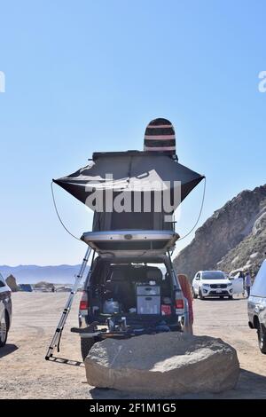 FRESNO, UNITED STATES - Mar 01, 2021: A cool photo of a a large tent on top of a vehicle with Morro Bay Rock,Ca. in the background during COVID 2021 Stock Photo