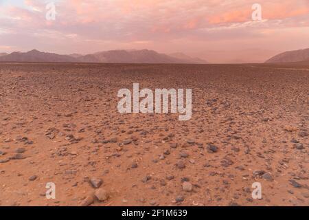 planet Mars.  Desert surface with mountain views. Stock Photo