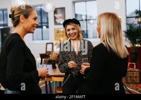 Female coworkers having meeting in cafe Stock Photo