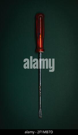 Screwdriver on grey background Stock Photo