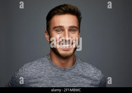 Studio shot of smiling young man Stock Photo