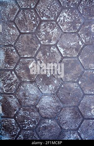 Surface decorating textured plaster design whicn differing in a relief of bee honeycombs of white color combinated with various shades of gray color. Stock Photo