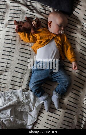 Baby boy sleeping with teddy bear Stock Photo