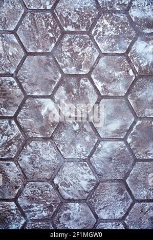 Texture background in the form of honeycombs in white and gray color gradient. Decorative coating for walls, ceilings and other items with effect of structural honeycombs. Stock Photo