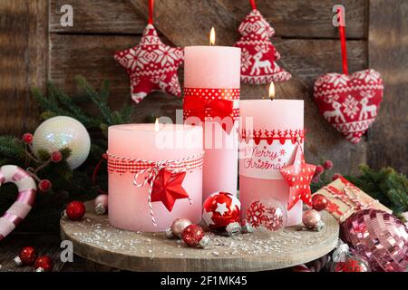 Pink candles and festive decorations Stock Photo