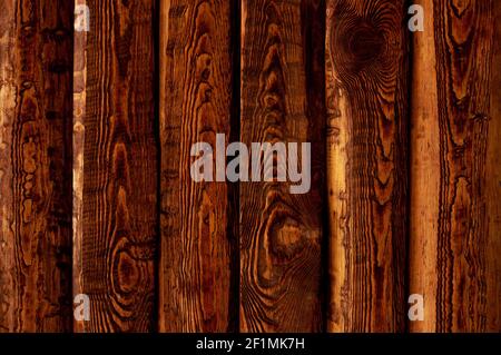 Dark stained brown wood surface with aged boards lined up Stock Photo