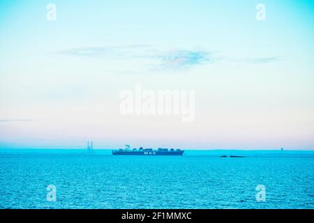 As Dawn Breaks Container Ship MSC Roma Entering the Thames en-route to London Gateway deep water port arriving from Antwerp Stock Photo