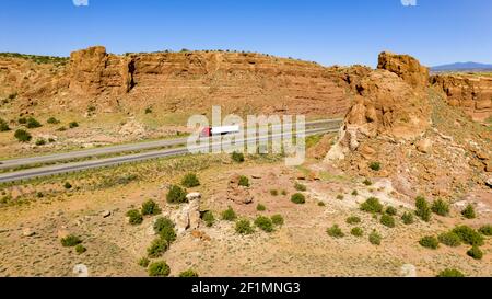 Vehicle Traffic moves along a Divided Highway in southwestern Desert Country Stock Photo