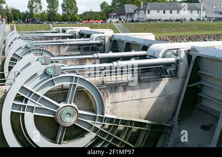 River locks and weir to regulate water flow in canal system Stock Photo