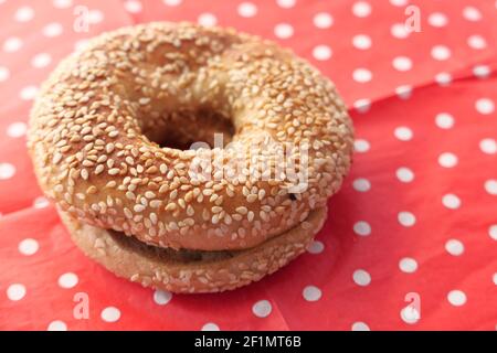 fresh bagel bread in a paper on table  Stock Photo