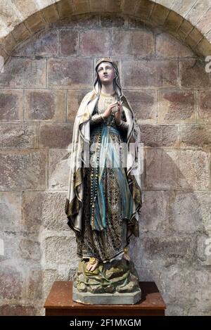 View of religious statue inside the Abbey Sainte-Croix in Quimperle Stock Photo