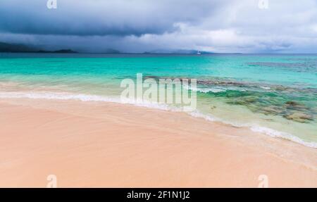 Empty beach under stormy sky on a daytime. Coastal landscape of Samana bay, Dominican republic Stock Photo