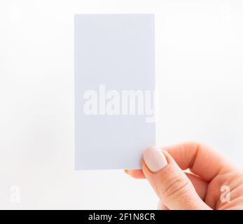 Hand holding empty white business card Stock Photo