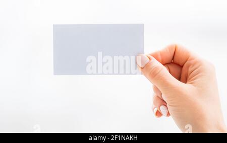 Hand holding empty white business card Stock Photo