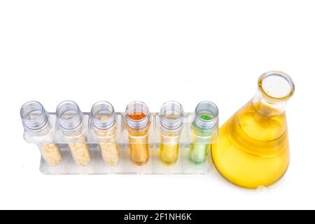 Ethanol biofuel derived from corn maze with beaker test tubes and corn in laboratory Stock Photo