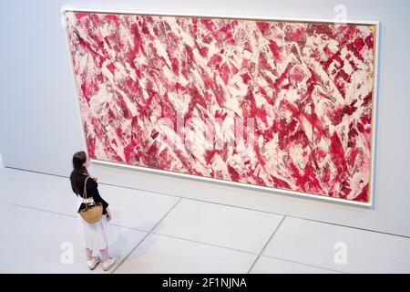 A woman takes a closer look at a painting in the exhibition Lee Krasner:Living Colour on display at the Barbican Centre in London. The female artist was a key figure in American art and a pioneer of Abstract Impressionism. This is the first major exhibition of her work for more than 50 years and tells the story of a formidable artist, whose importance has too often been eclipsed by her marriage to Jackson Pollock. Photo credit should read: Katie Collins/EMPICS/Alamy Stock Photo