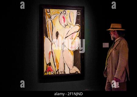 A man takes a closer look at a painting in the exhibition Lee Krasner:Living Colour on display at the Barbican Centre in London. The female artist was a key figure in American art and a pioneer of Abstract Impressionism. This is the first major exhibition of her work for more than 50 years and tells the story of a formidable artist, whose importance has too often been eclipsed by her marriage to Jackson Pollock. Photo credit should read: Katie Collins/EMPICS/Alamy Stock Photo