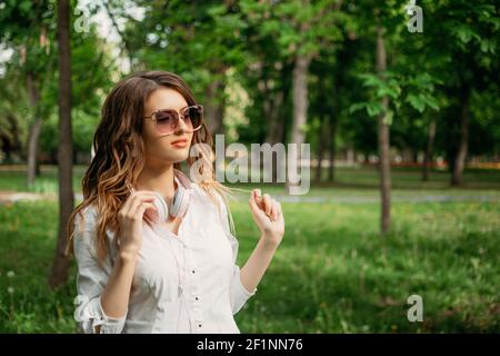 Work life balance, Essentials of Wellbeing, harmony between work and personal life. Young business women in formal suit and sunglasses enjoying the Stock Photo