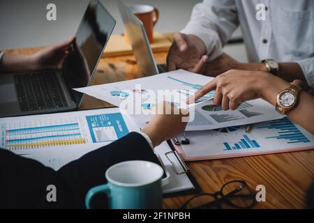 Shot of Business team working new startup project and discussing the charts and graphs showing the results at meeting accounting and financial. Stock Photo