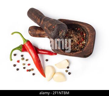 Mortar And Pestle With Pepper And Spices Stock Photo