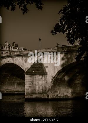 Early morning light shines on the Pont du Carrousel bridge over the river Seine in Paris France Stock Photo