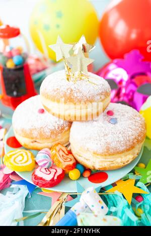 Delicious doughnuts with colorful candies Stock Photo