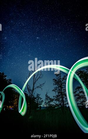Neon lights on nature at night Stock Photo