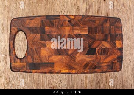 Cutting board on a wooden table Stock Photo