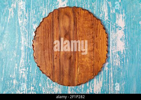 Cutting board on a wooden table Stock Photo